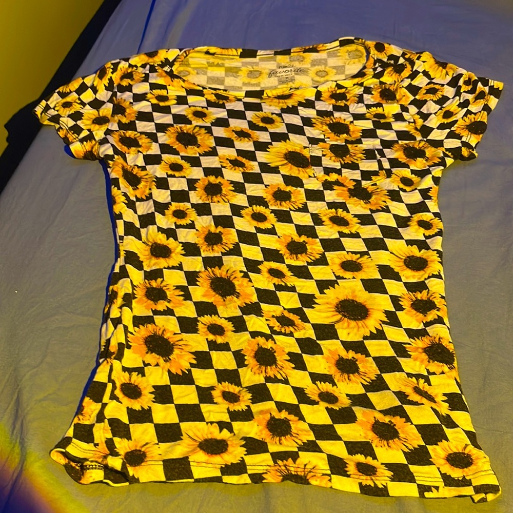 This is a black and white pattern shirt with sunflowers all over it.